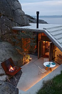 Naturally-Sheltered Summer Cabin Dialogues With The Cliffs